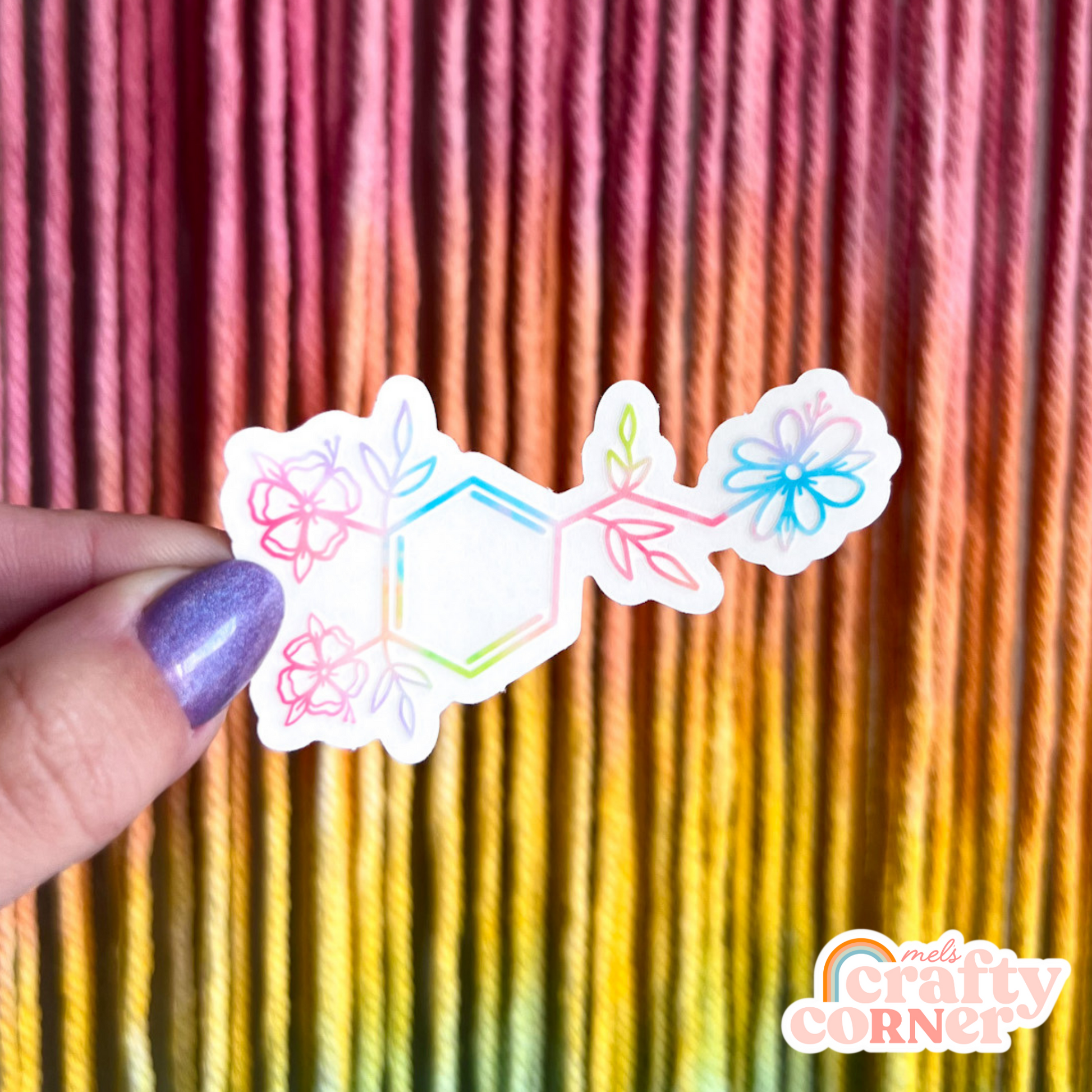 Hand holding Floral Dopamine colorful clear sticker showing size and scale by Mel's Crafty Corner