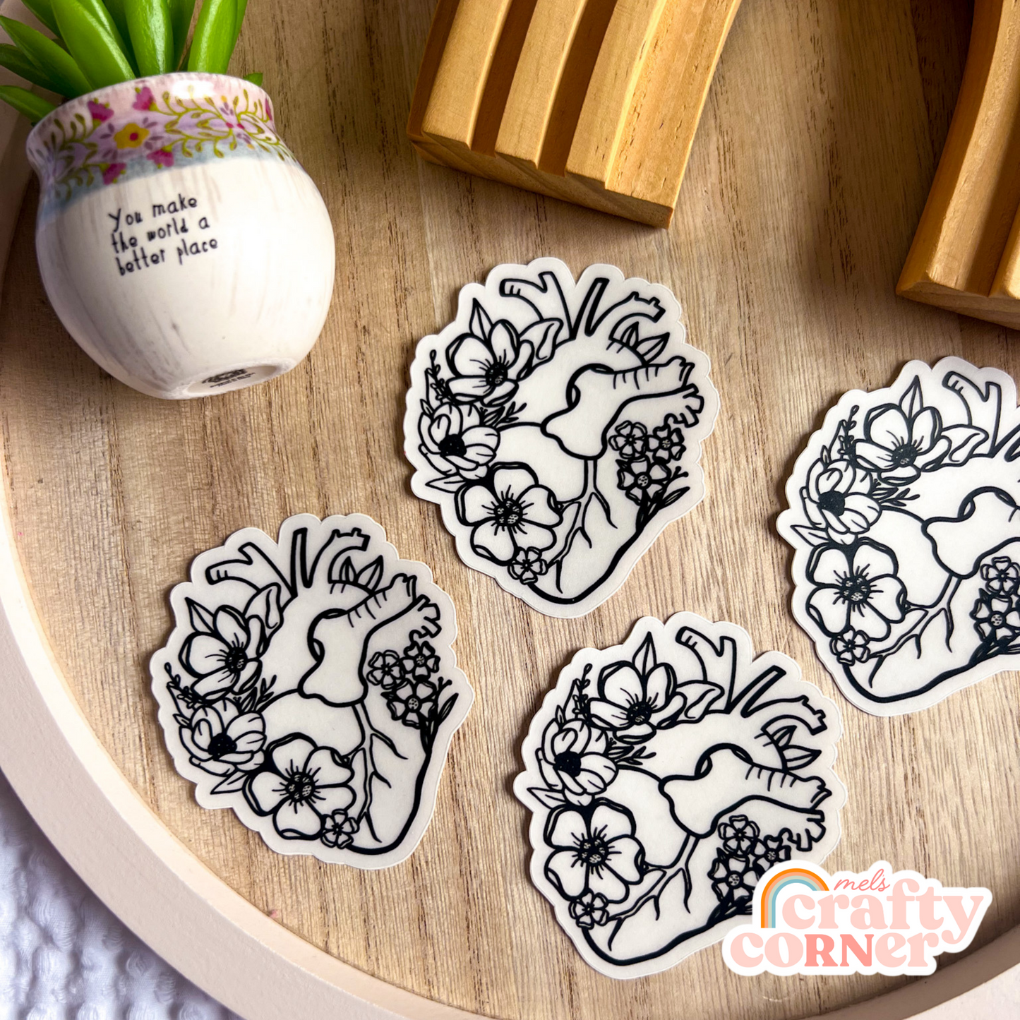 Multiple stickers including Floral Anatomical Heart black clear sticker showing collection display by Mel's Crafty Corner