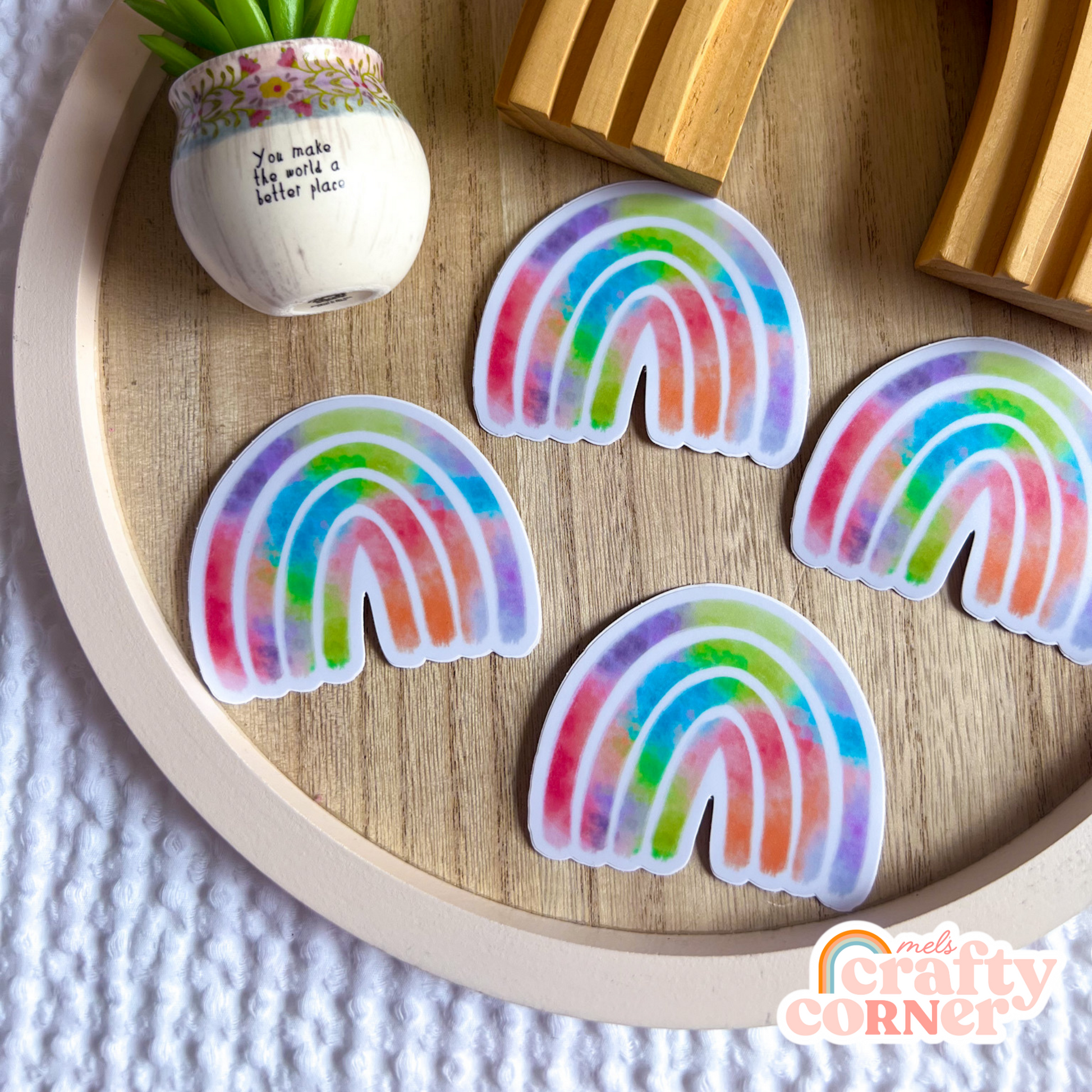 Multiple stickers including Rainbow colorful matte sticker showing collection display by Mel's Crafty Corner