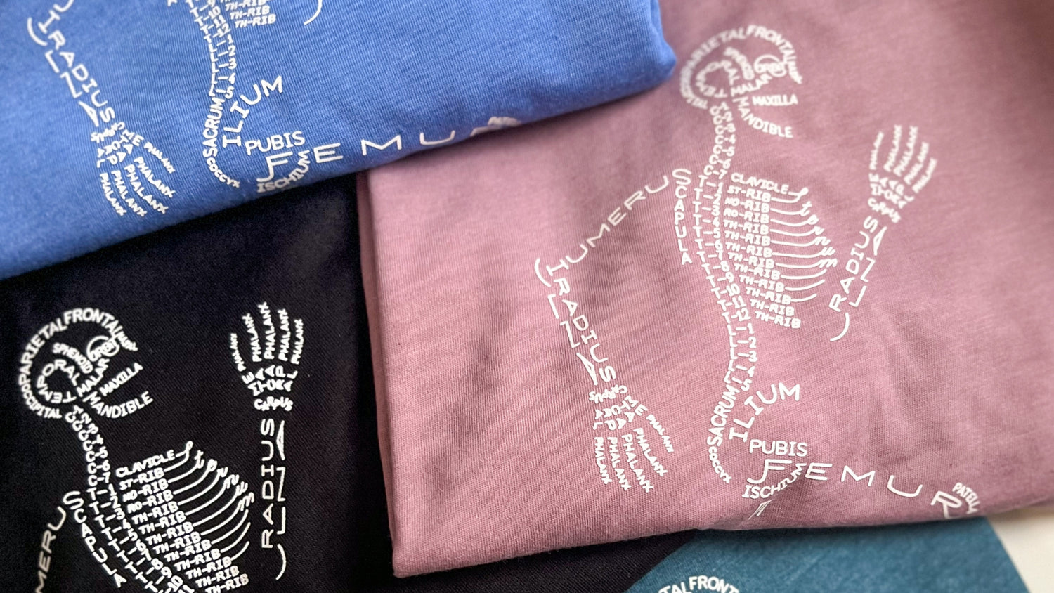 Stack of custom group order t-shirts by Mel's Crafty Corner