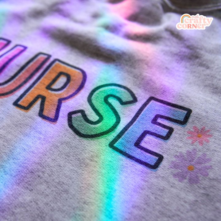Close-up detail of Colorful Nurse design on classic crewneck sweatshirt by Mel's Crafty Corner