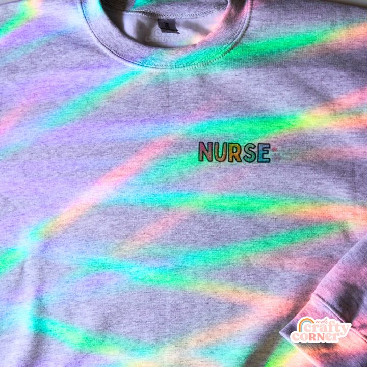 Pocket version of Colorful Nurse design on classic crewneck sweatshirt by Mel's Crafty Corner