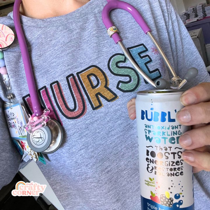 Model Mel wearing Colorful Nurse t-shirt holding Bubbl'r drink by Mel's Crafty Corner