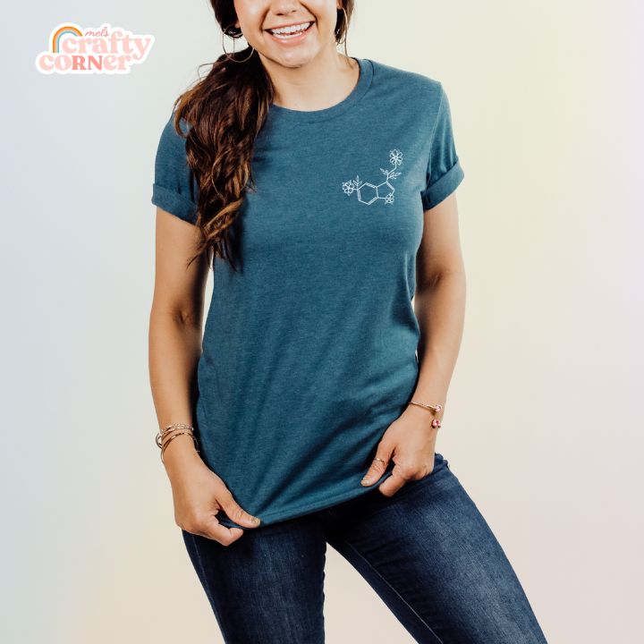 Model wearing Floral Serotonin soft t-shirt in deep teal