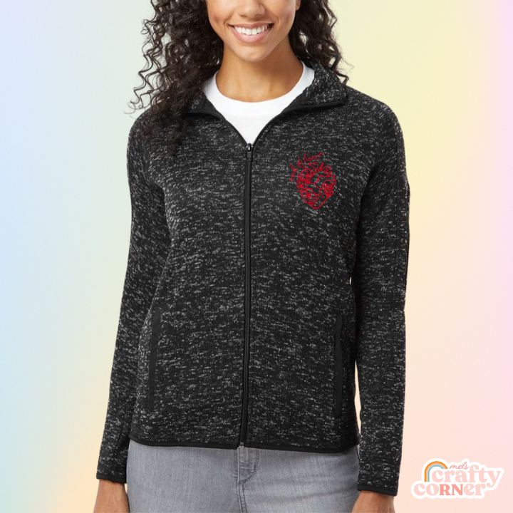 Model wearing heather black Floral Anatomical Heart (WOH) fleece zip-up jacket by Mel's Crafty Corner