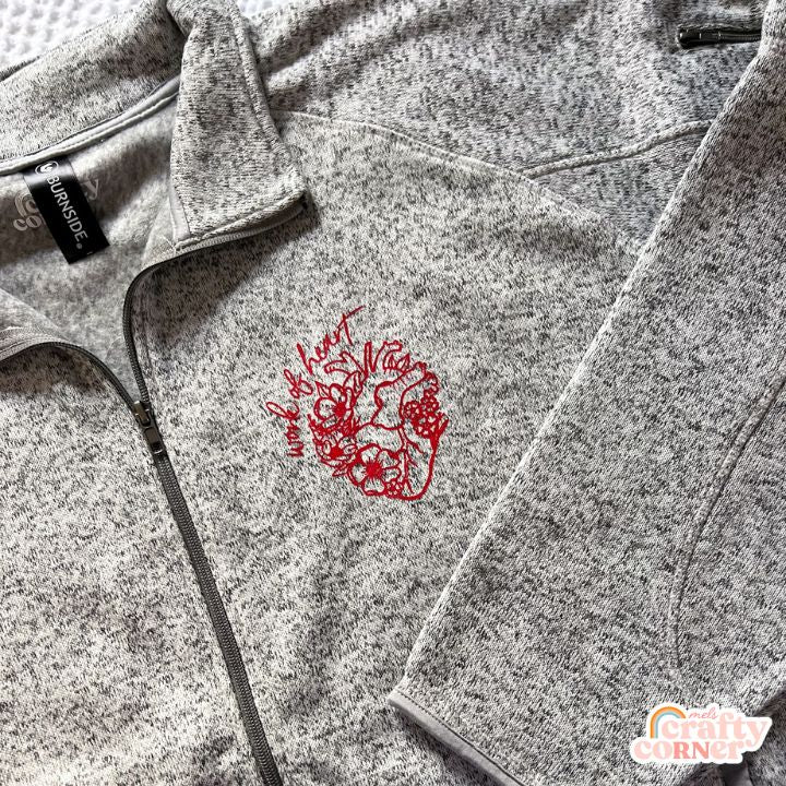 Second flat lay view of heather grey Floral Anatomical Heart (WOH) fleece zip-up jacket by Mel's Crafty Corner