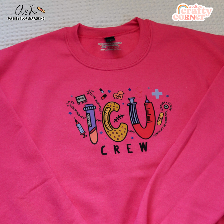 Third view of ICU Crew Merch heliconia pink crewneck sweatshirt showing full design by Mel's Crafty Corner