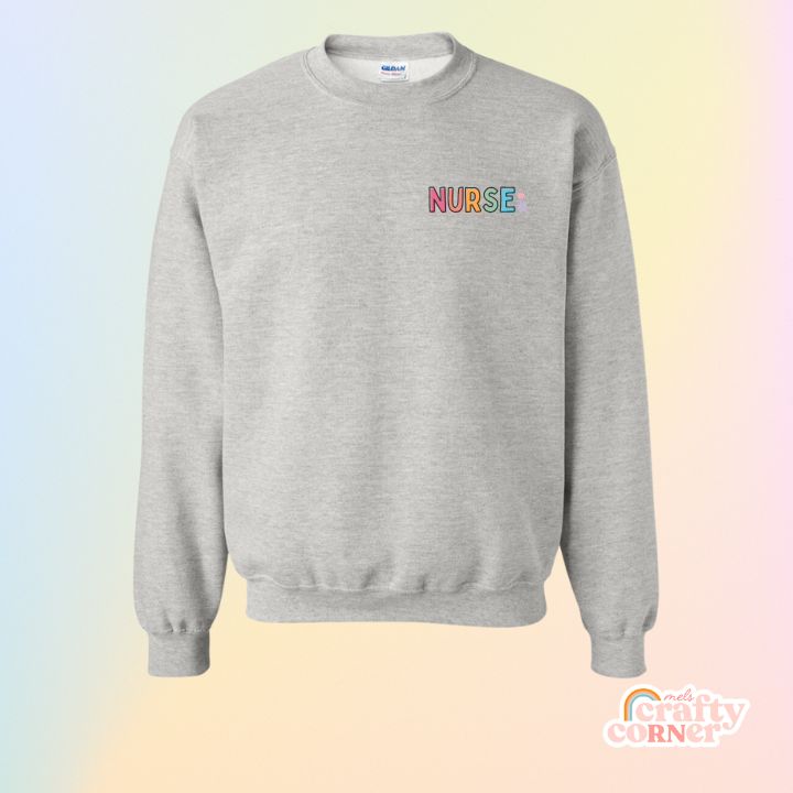 Mockup of pocket Colorful Nurse design on classic crewneck sweatshirt by Mel's Crafty Corner