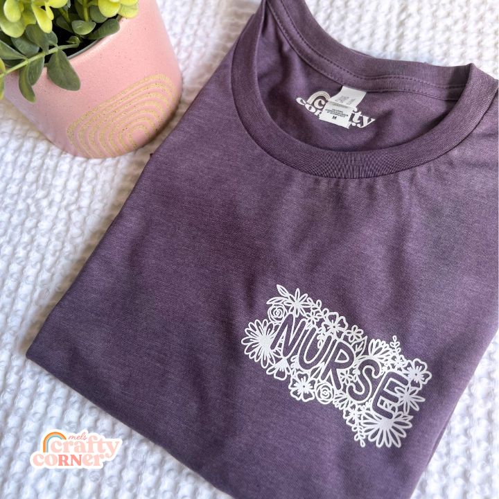 Purple Pocket Floral Nurse T-Shirt worn by model