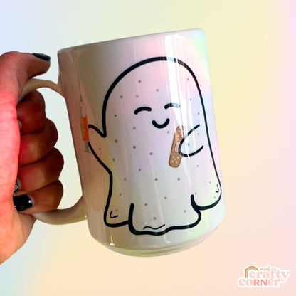 Side view of Boo-Boo Ghostie 15 oz ceramic mug showing design details by Mel's Crafty Corner