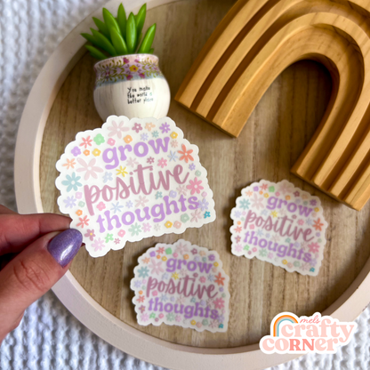 Hand holding Grow Positive Thoughts clear sticker showing size and scale by Mel's Crafty Corner