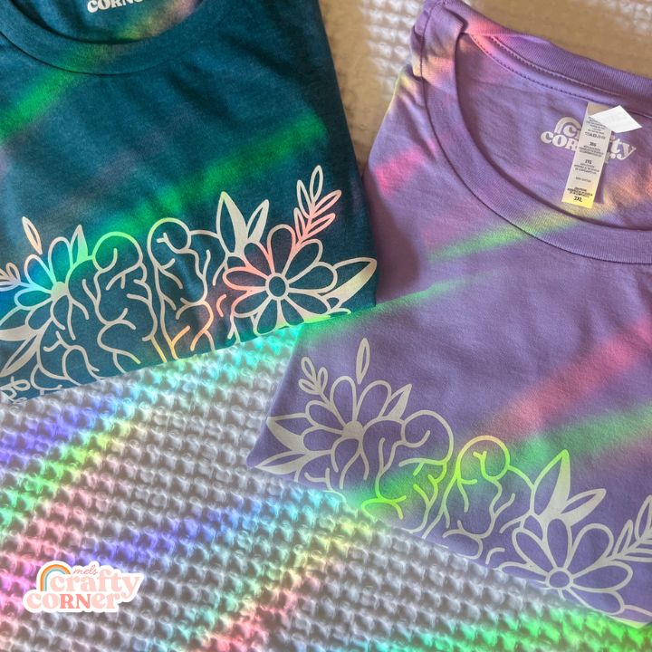 Rainbow collection of folded Be Kind to Your Mind t-shirts