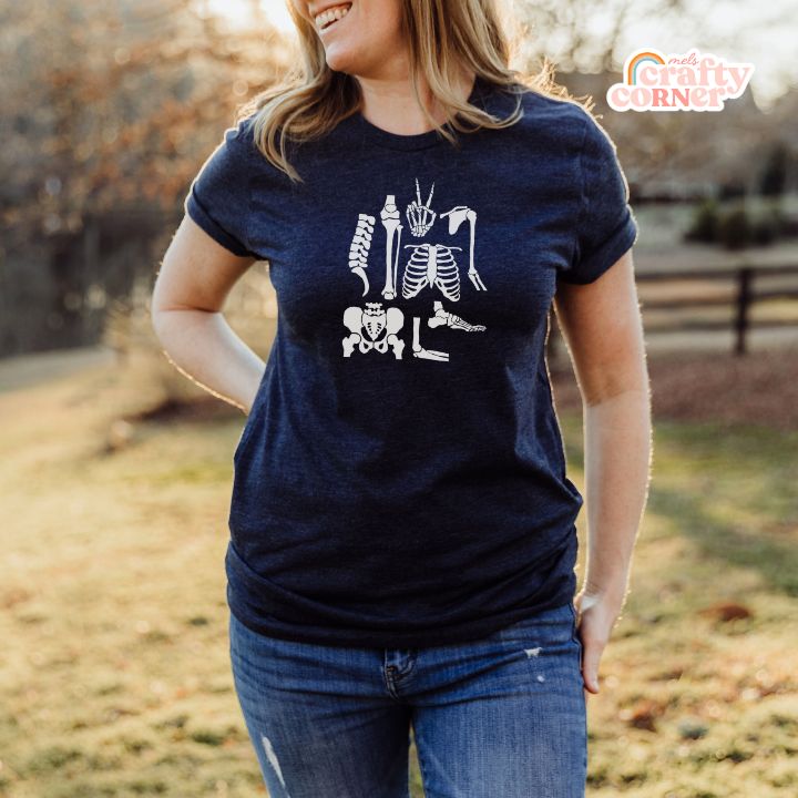 Model wearing navy Build Your Boneyard softest t-shirt showing back view by Mel's Crafty Corner