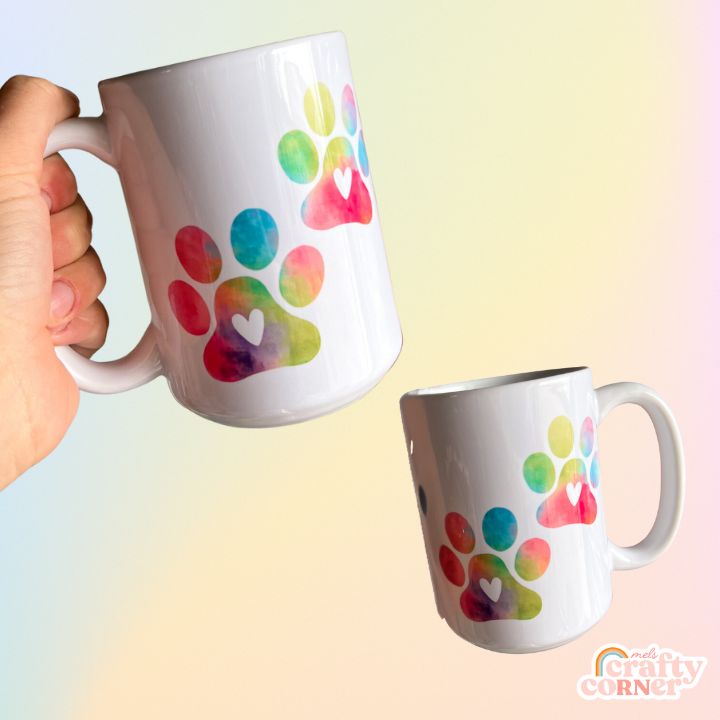 Mockup of Colorful Paw Print 15 oz ceramic mug showing design details by Mel's Crafty Corner