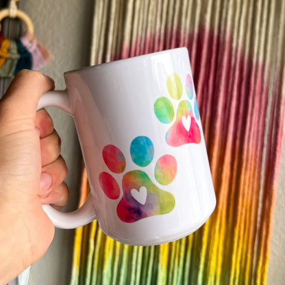 Side view of Colorful Paw Print 15 oz ceramic mug showing primary design by Mel's Crafty Corner