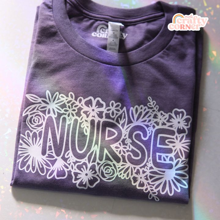 Purple Floral Nurse soft t-shirt laid flat