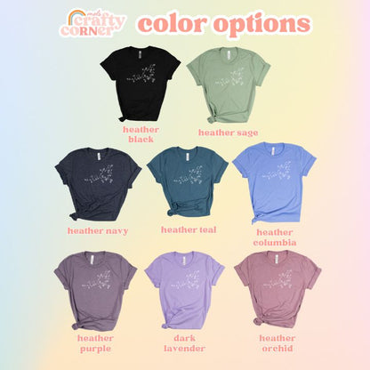 Multiple color variations of Floral Oxytocin soft t-shirt displayed