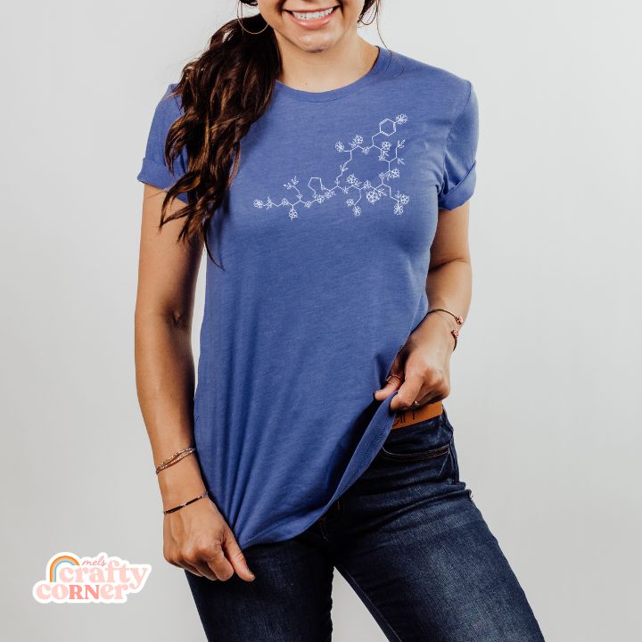 Model wearing Floral Oxytocin soft t-shirt in Columbia blue