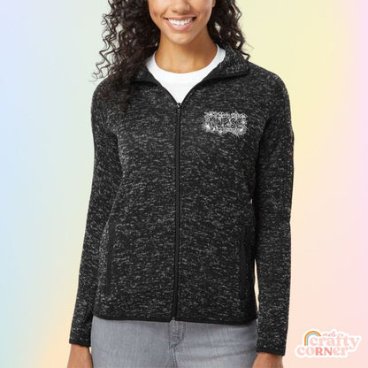 Model wearing heather black Floral Nurse fleece zip-up jacket by Mel's Crafty Corner