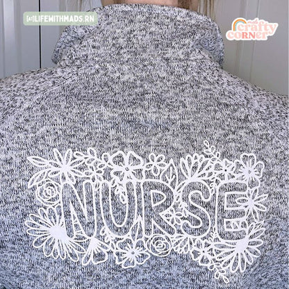 Close-up of back design on heather grey Floral Nurse fleece zip-up jacket by Mel's Crafty Corner