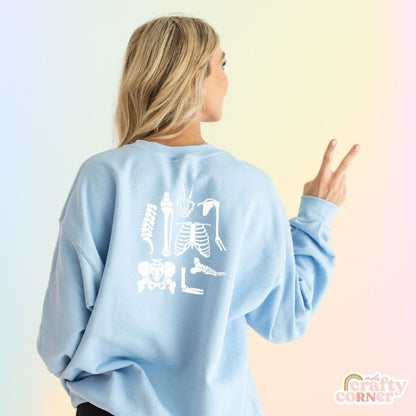 Back view of light blue Build Your Boneyard classic crewneck sweatshirt by Mel's Crafty Corner