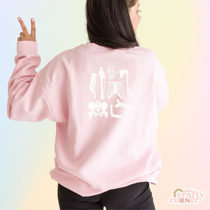 Back view of light pink Build Your Boneyard classic crewneck sweatshirt by Mel's Crafty Corner