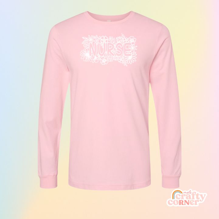 Pink Floral Nurse soft long sleeve shirt mockup by Mel's Crafty Corner