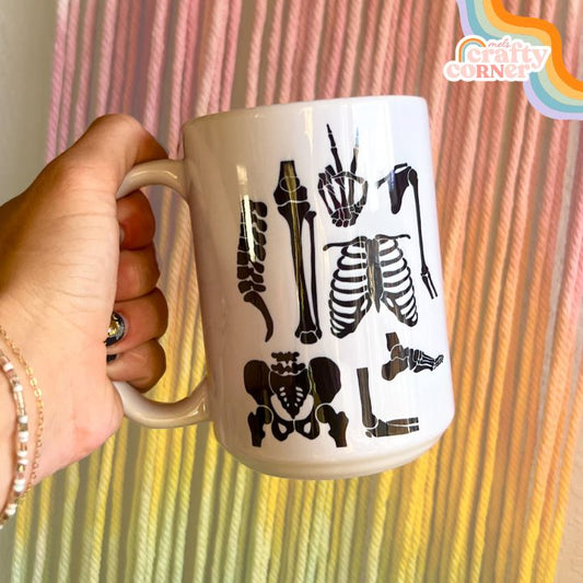 Skeleton Boneyard design on 15 oz ceramic mug, main product image by Mel's Crafty Corner