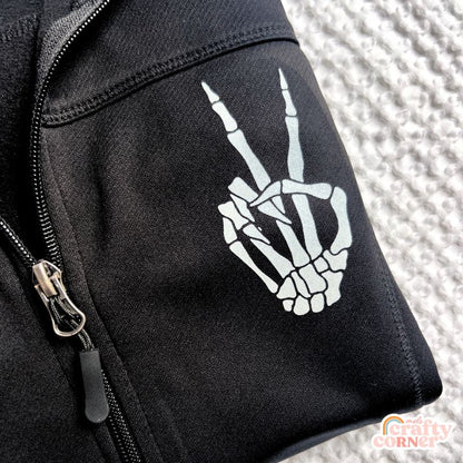 Close-up of Skeleton Peace Sign design on performance zip-up jacket by Mel's Crafty Corner