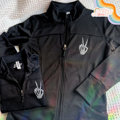 Skeleton Peace Sign design on performance zip-up jacket, main product image by Mel's Crafty Corner