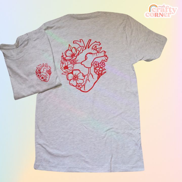Model wearing ash gray Floral Anatomical Heart softest t-shirt by Mel's Crafty Corner