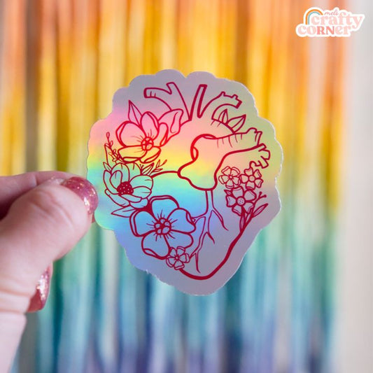 Floral Anatomical Heart design on red holographic sticker, main product image by Mel's Crafty Corner