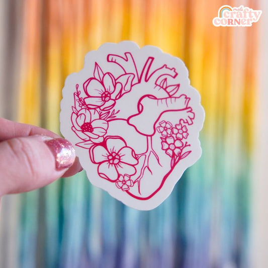 Floral Anatomical Heart design on red matte sticker, main product image by Mel's Crafty Corner